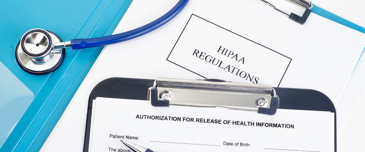 HIPAA regulations form on a clipboard