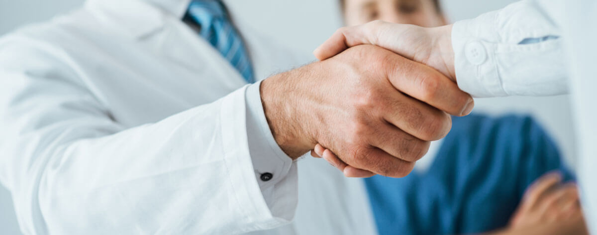 two doctors shaking hands