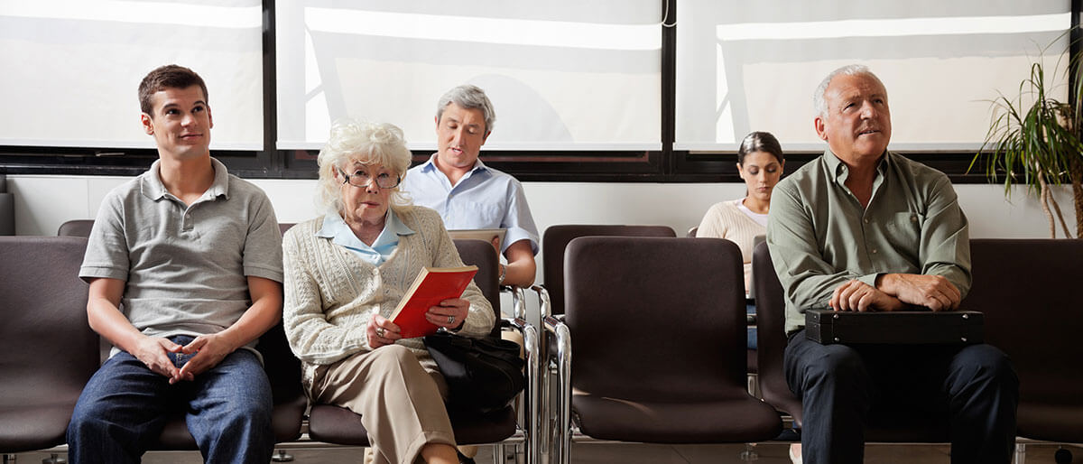varied patients seated in a waiting room